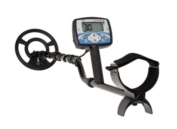 A metal detector with a digital display and armrest shown against a plain white background